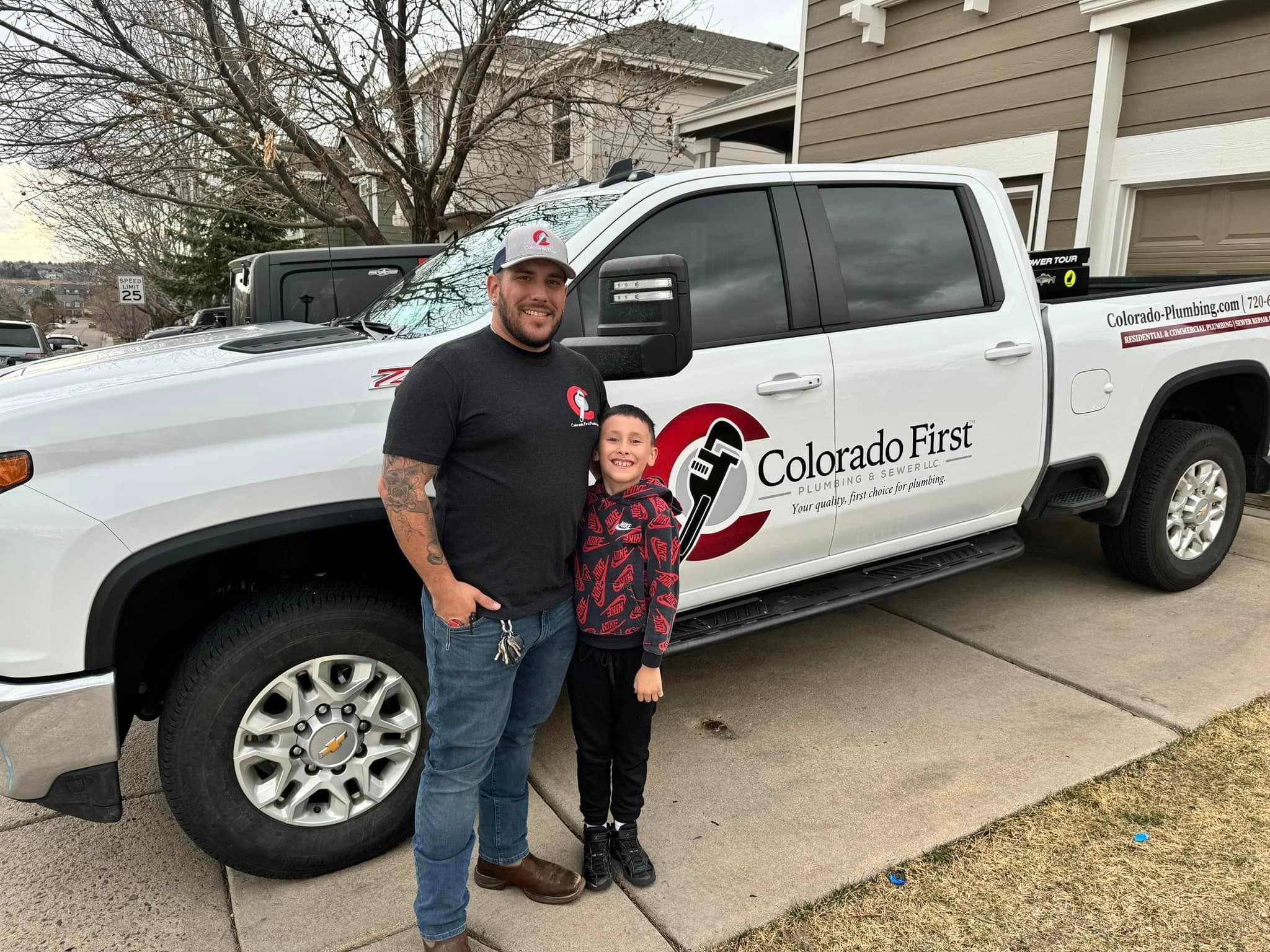 Codee with his son at work truck