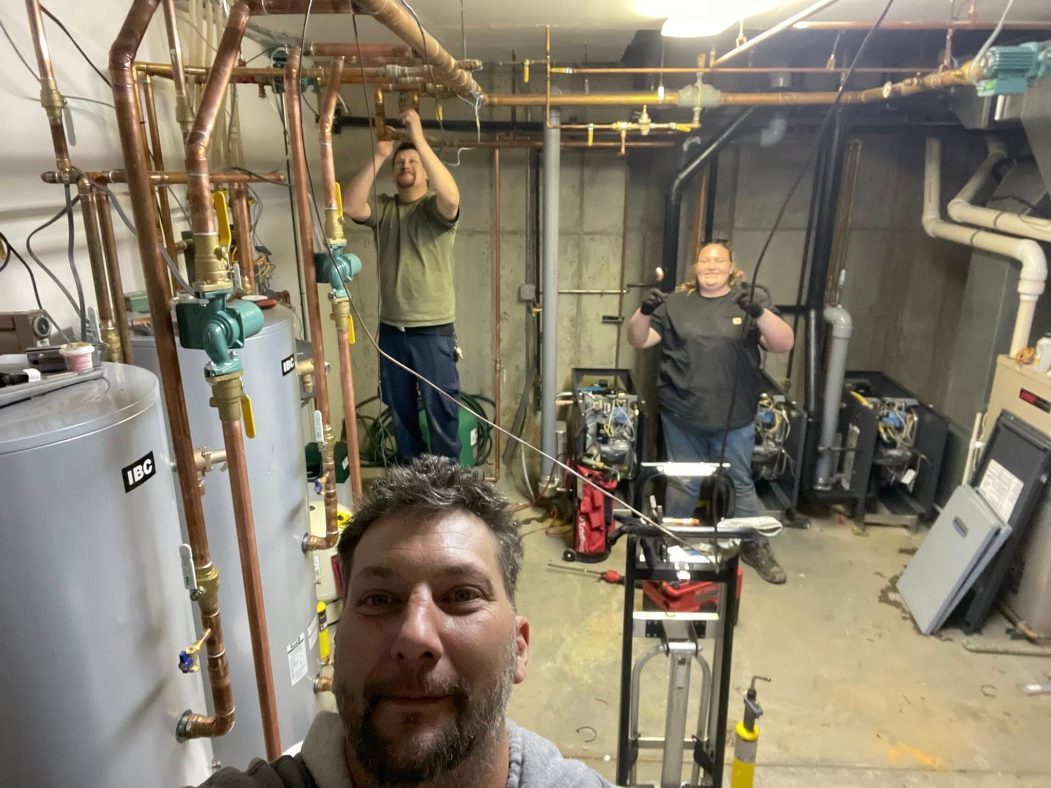 Nathan Locke and crew working in a boiler mechanical room