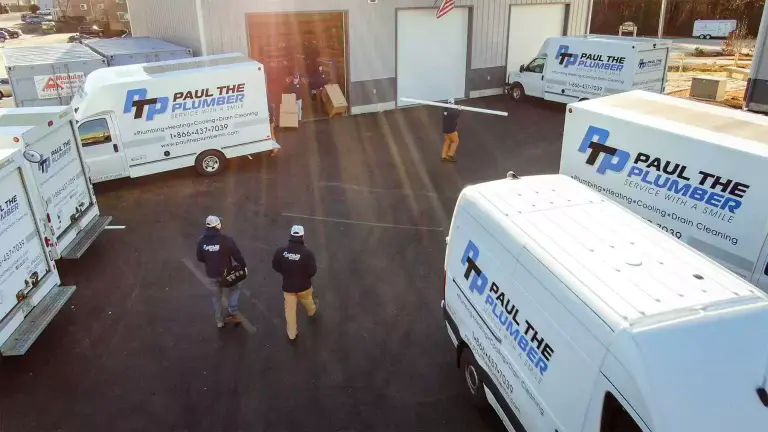 Paul the Plumber crew and branded fleet at the Derry shop